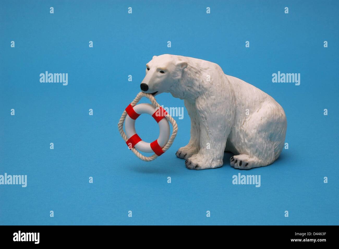 Illustration - A miniature polar bear holds a minature safety buoy in his mouth in Berlin, Germany, 22 December 2007. Photo: Berliner Verlag/S.Steinach Stock Photo