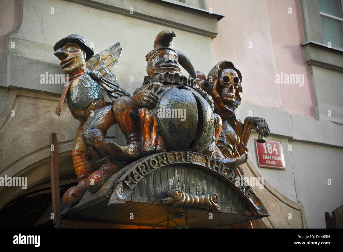 Wooden carvings above entrance to Marionette Theatre, Prague Stock Photo