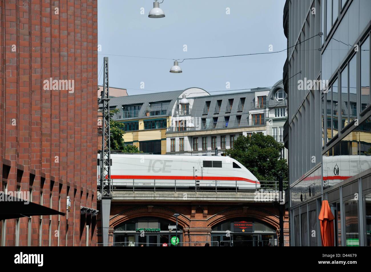 An ICE passing through Berlin is pictured in between two buildings at Liftass Square near Hackescher Markt in Berlin, Germany, 21 August 2011. Photo: Berliner Verlag/S.Steinach Stock Photo