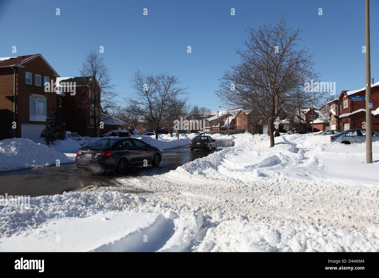 snow covered residential street Stock Photo