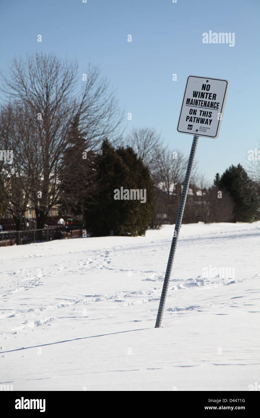 no winter maintenance sign snow covered ground Stock Photo