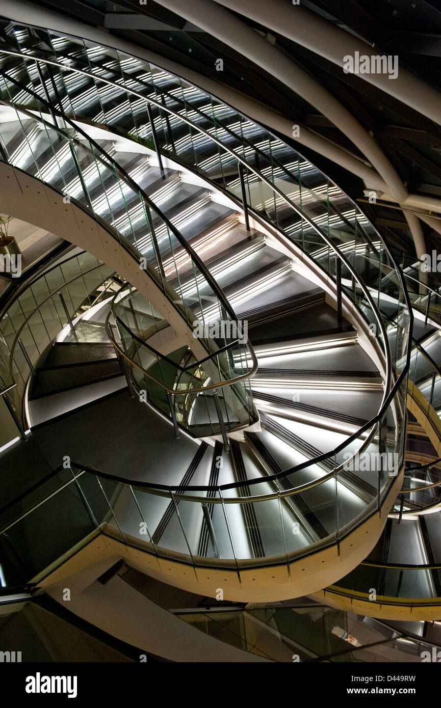 Spiral staircase featuring stainless steel and glass. Stock Photo