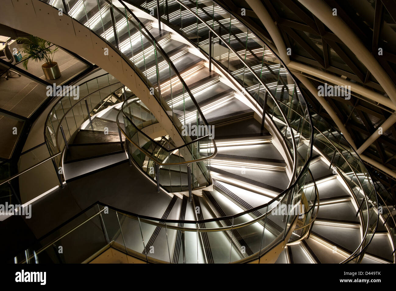 Spiral staircase featuring stainless steel and glass. Stock Photo
