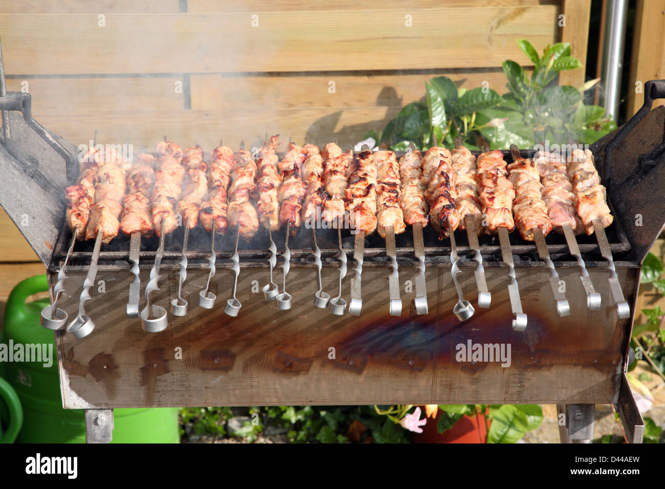 Roasted shish kebab on the grill. Stock Photo