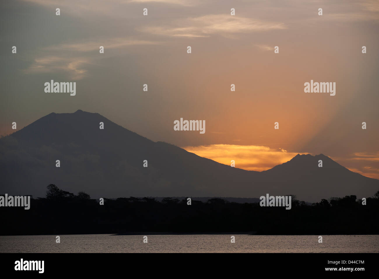 Panoramic view of the Raung (left) and Baluran (right) Volcanos on Eastern Java at sunset from Western Bali. Stock Photo