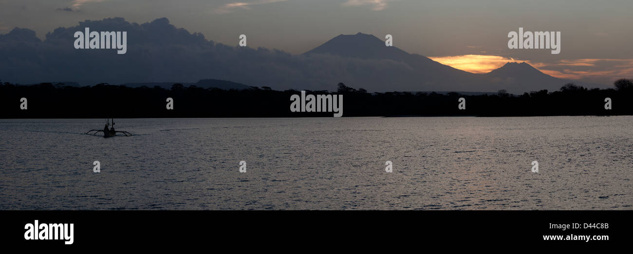 Panoramic view of the Raung (left) and Baluran (right) Volcanos on Eastern Java at sunset from Western Bali. Stock Photo