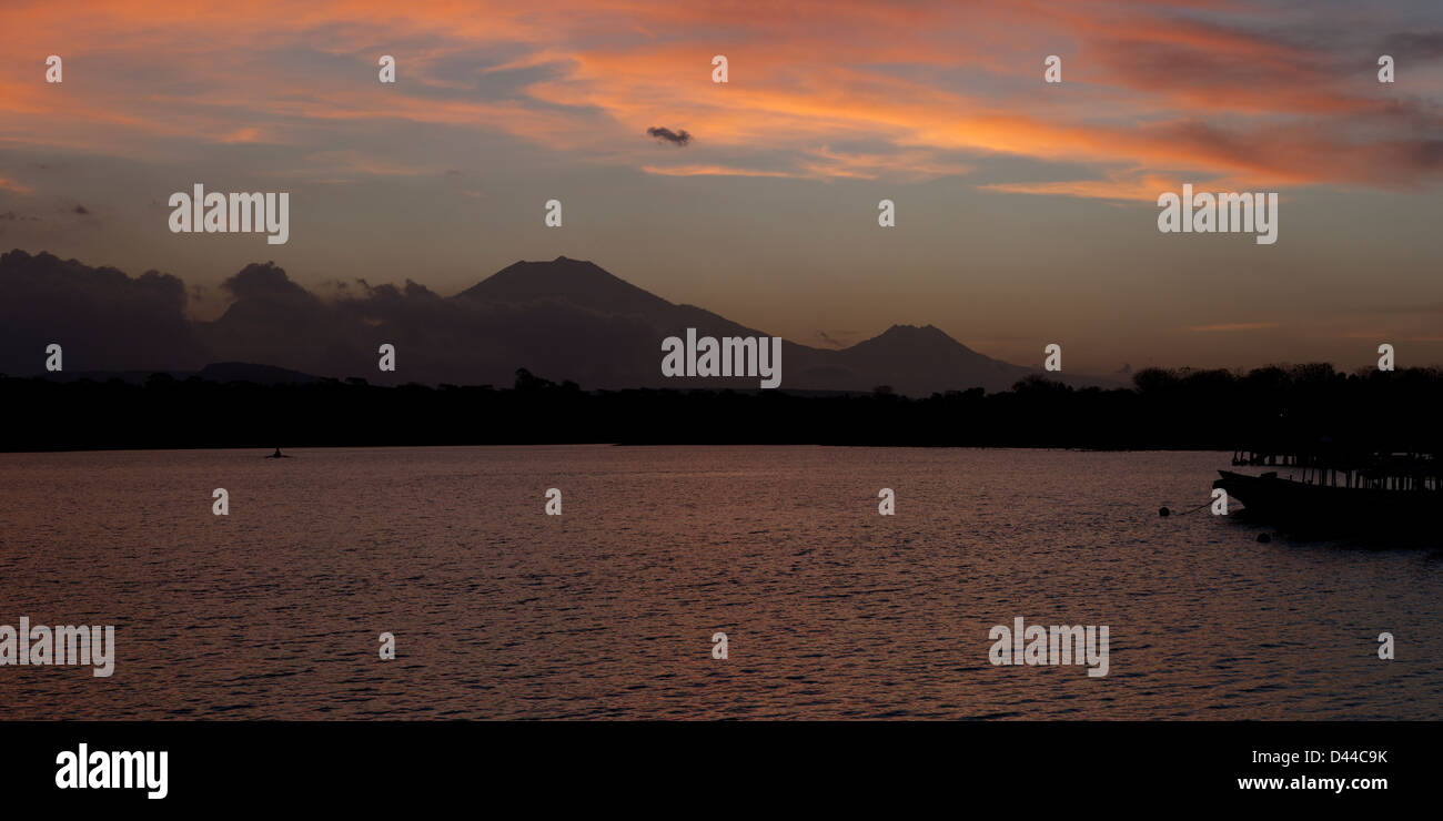 Panoramic view of the Raung (left) and Baluran (right) Volcanos on Eastern Java at sunset from Western Bali. Stock Photo