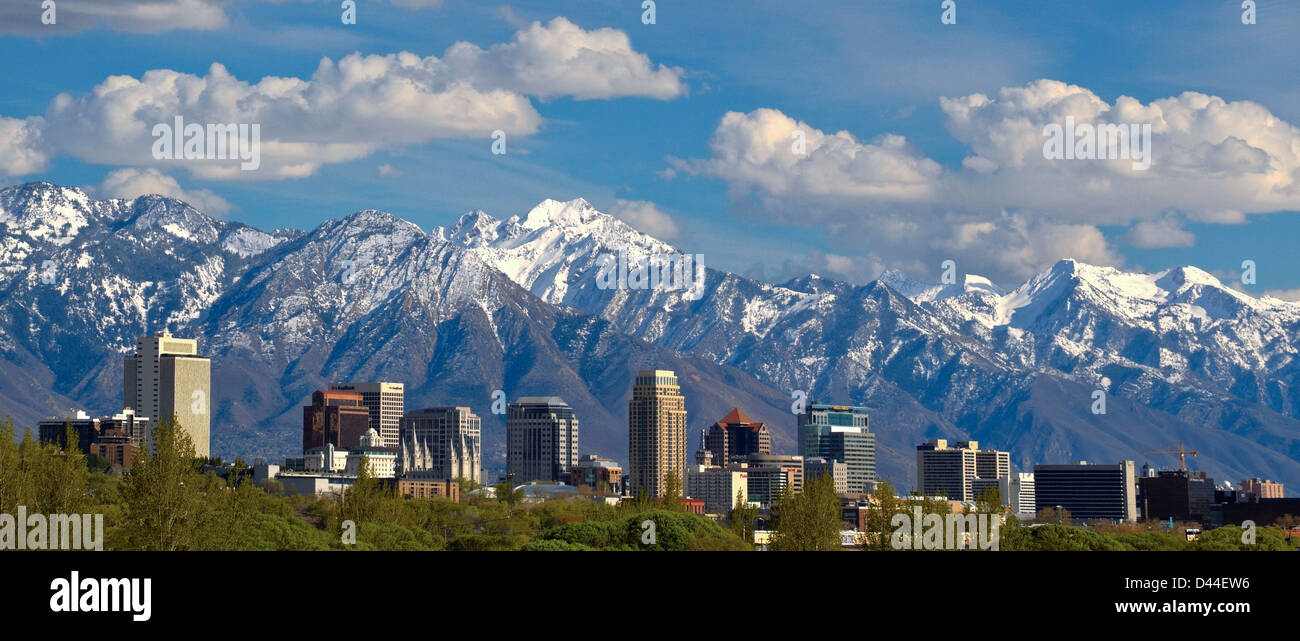 Panoramic view of the downtown Salt Lake City skyline in early spring with the snow capped Wasatch Mountains in the background Stock Photo