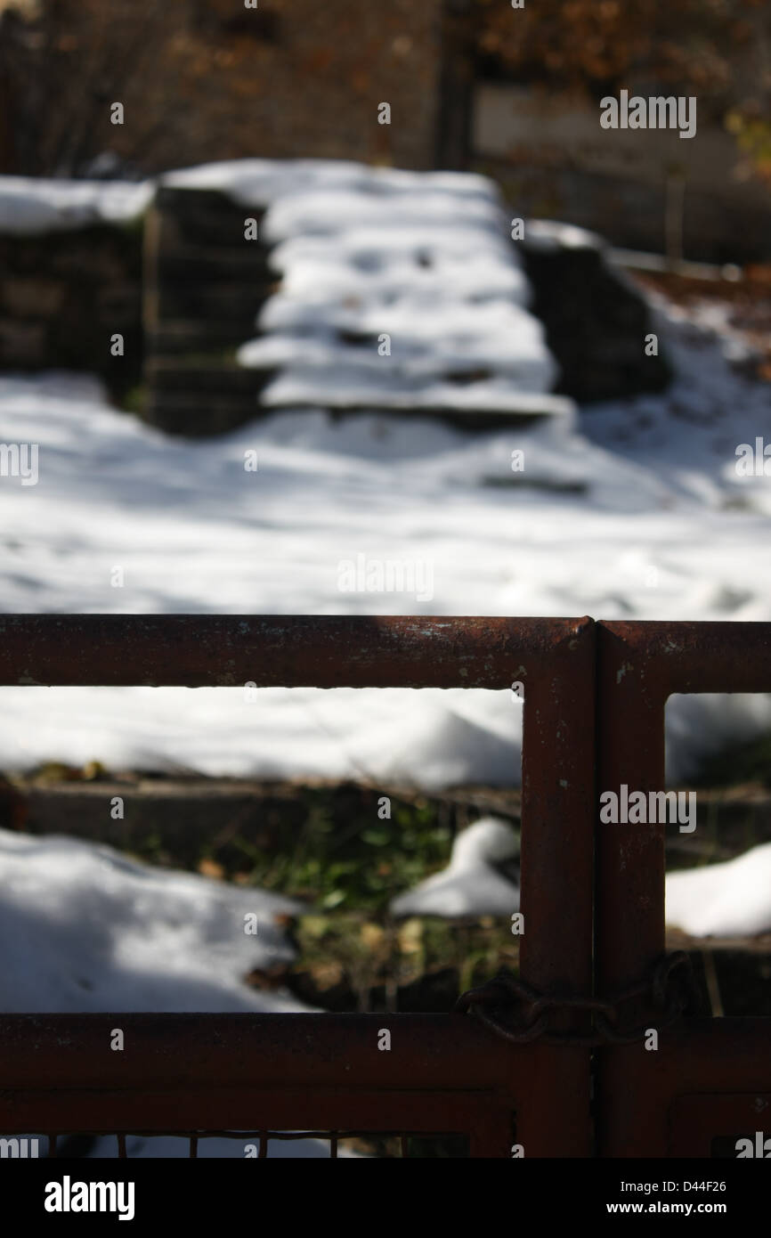 Snowy stairs behind closed Doors Stock Photo
