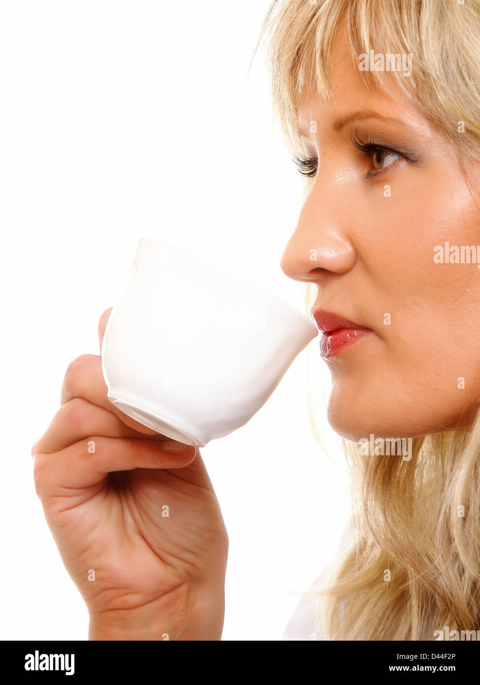 Beautiful woman drinking tea or coffee. Cup of Hot Beverage side view ...