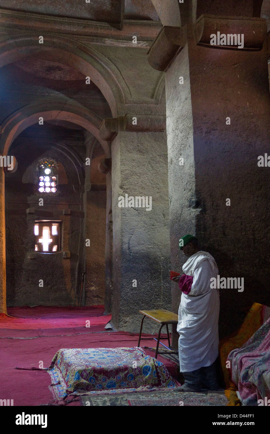 Man praying in the Church of Saint George interior, Lalibela, Ethiopia ...
