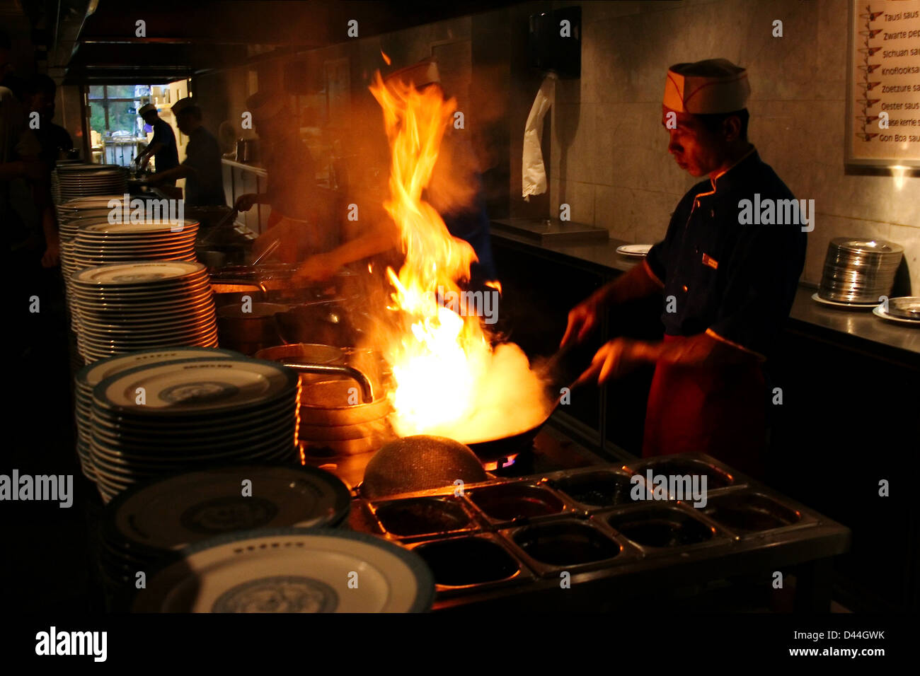 Cooking in wok restaurant Stock Photo