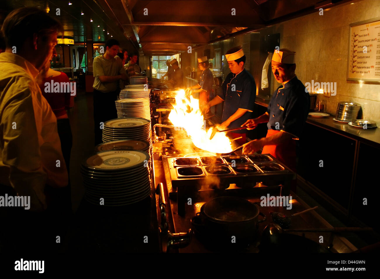 Cooking in wok restaurant Stock Photo