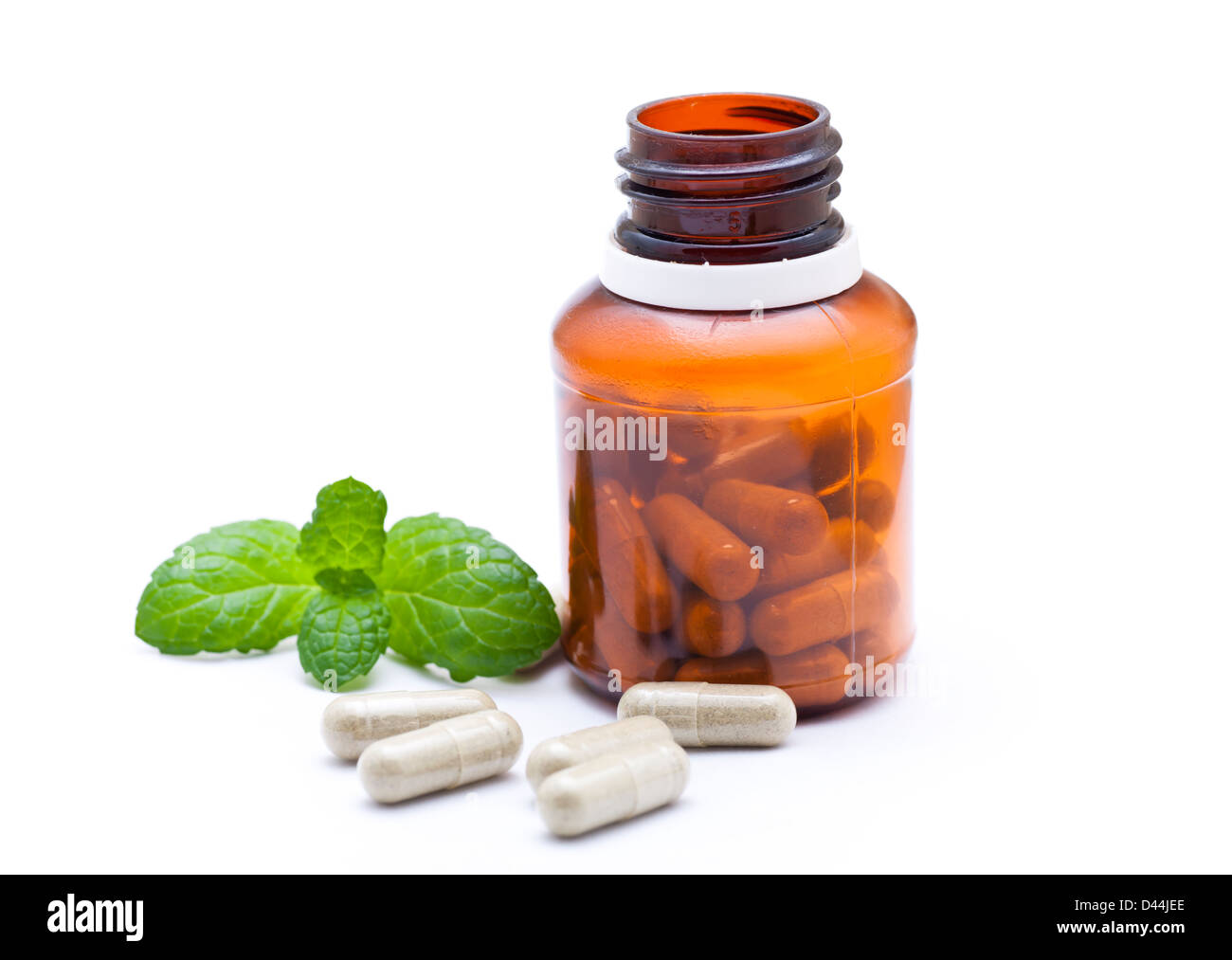 Organic capsule with mint leaves Stock Photo