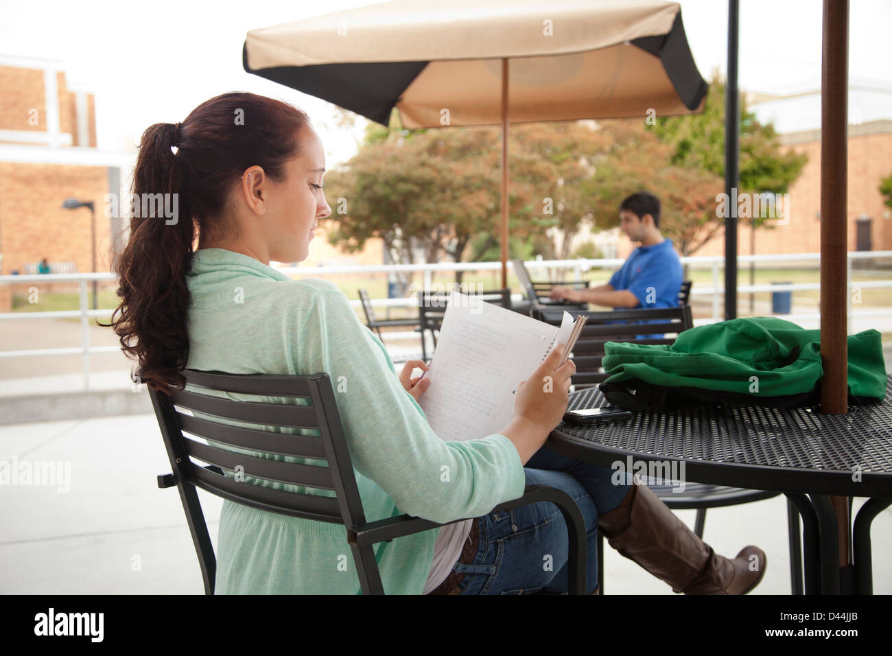 Students studying at tables on campus Stock Photo Alamy