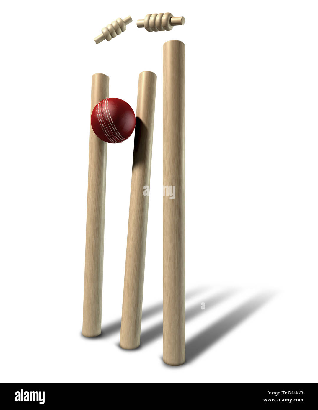 A red leather cricket ball striking and unsettling wooden cricket wickets and bails on an isolated background Stock Photo