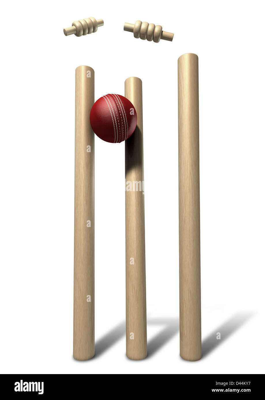A red leather cricket ball striking and unsettling wooden cricket wickets and bails on an isolated background Stock Photo