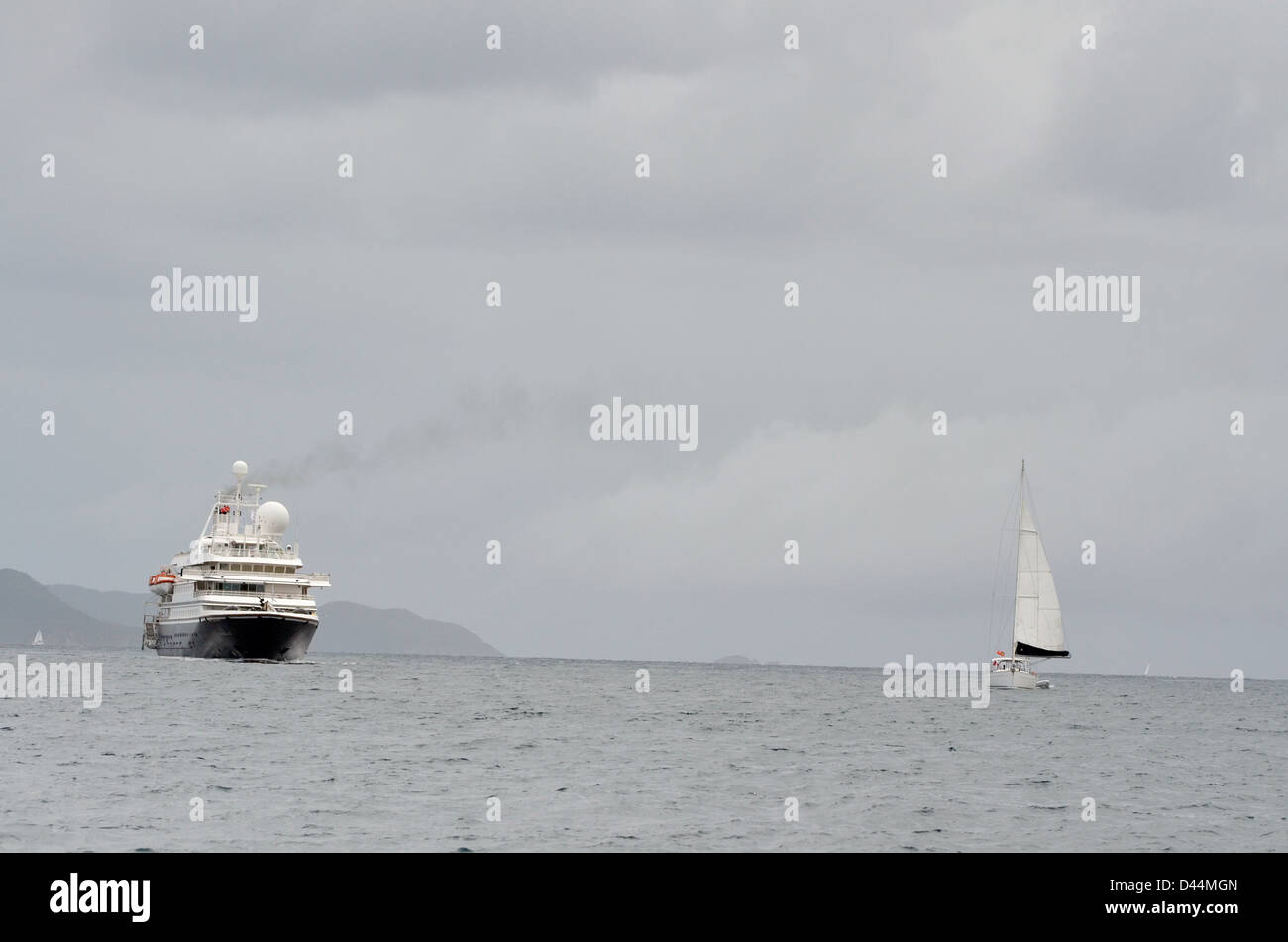 Cruise ship and sailboats in the Virgin Islands. Stock Photo