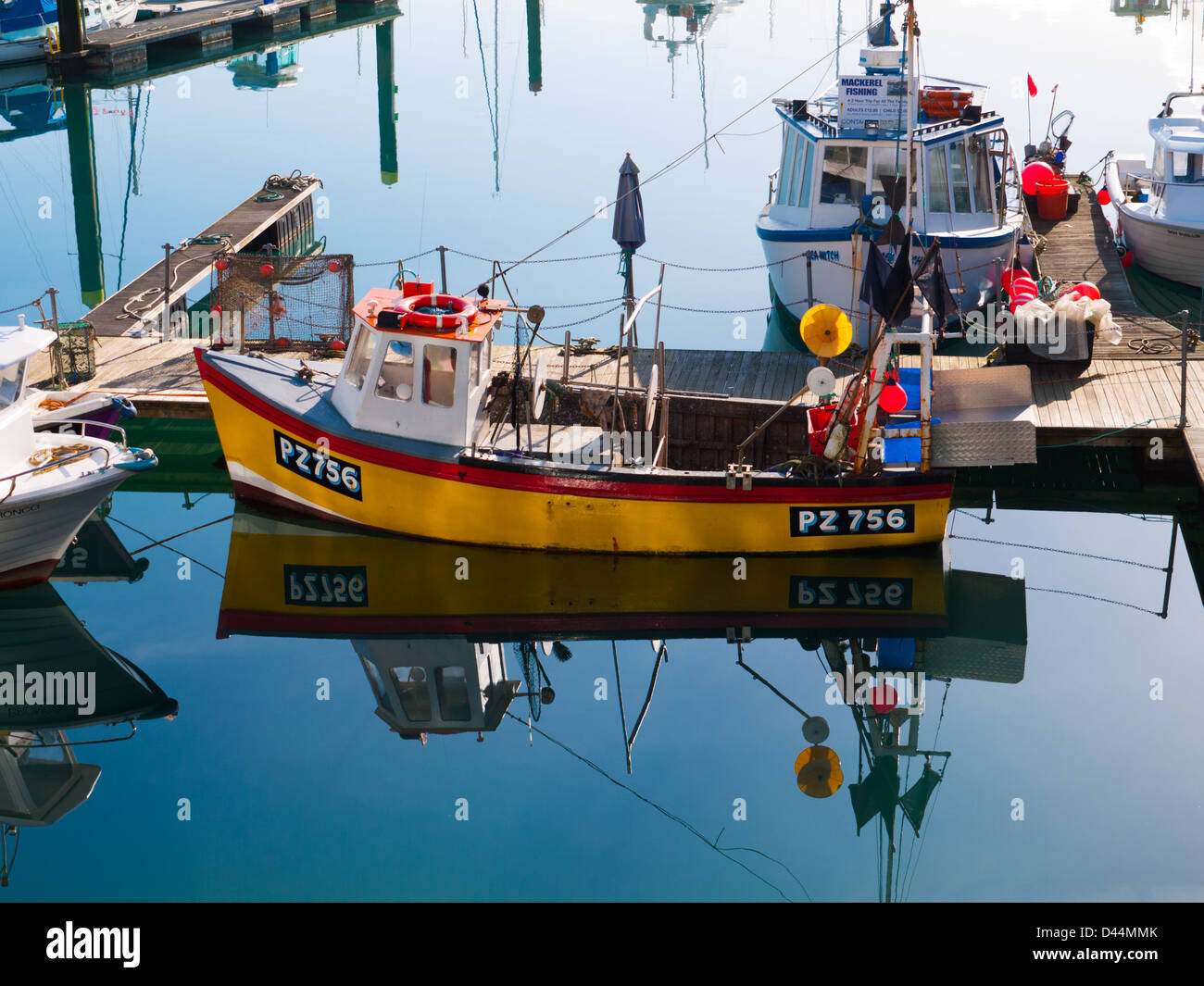 Brightly painted fishing boat moored in Torquay harbour, Devon, UK. Stock Photo
