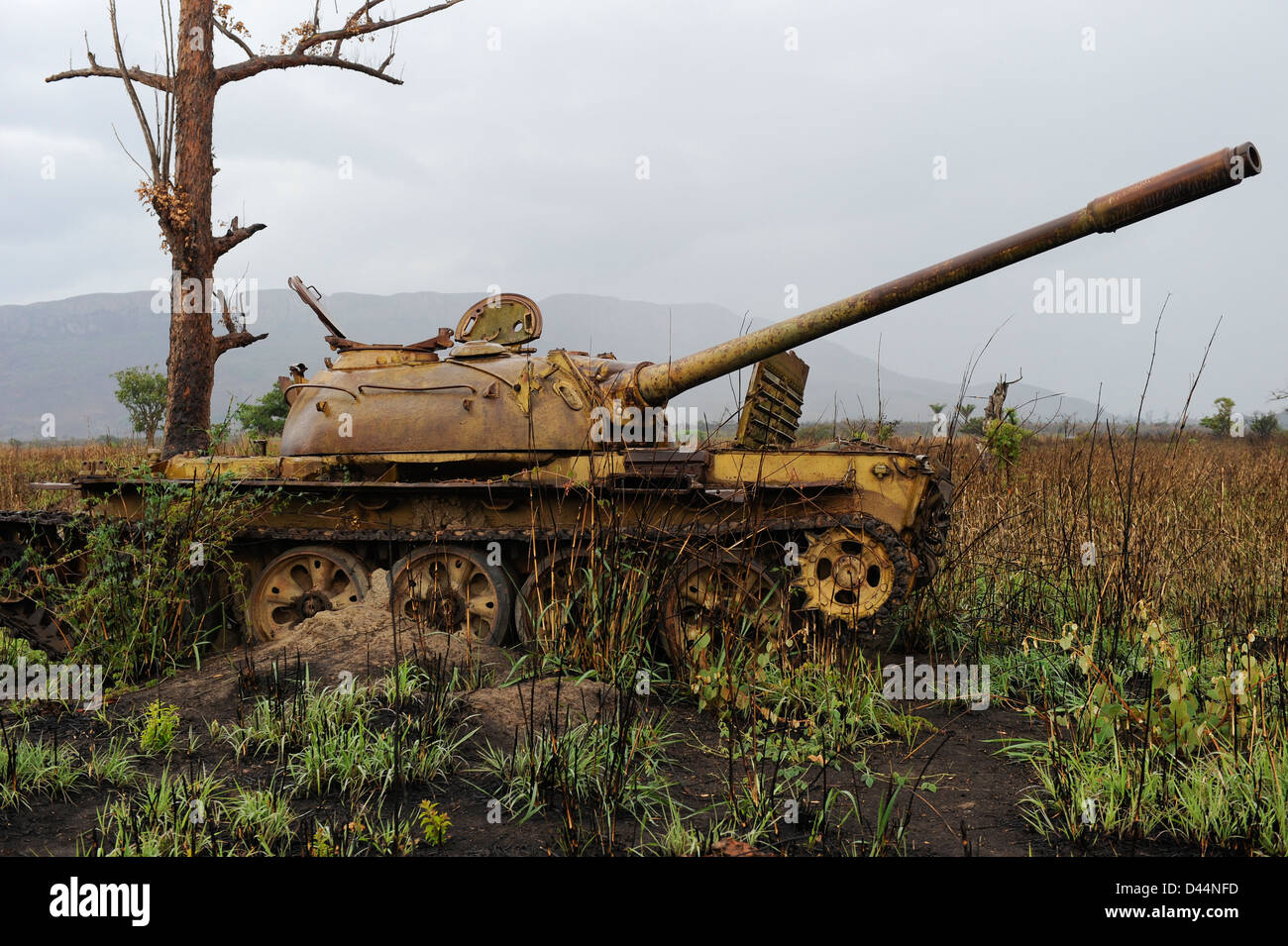 Africa ANGOLA, wreck of old soviet russian battle tank T-54 from civil war between MPLA and UNITA near Quibala, some areas have still land mines Stock Photo