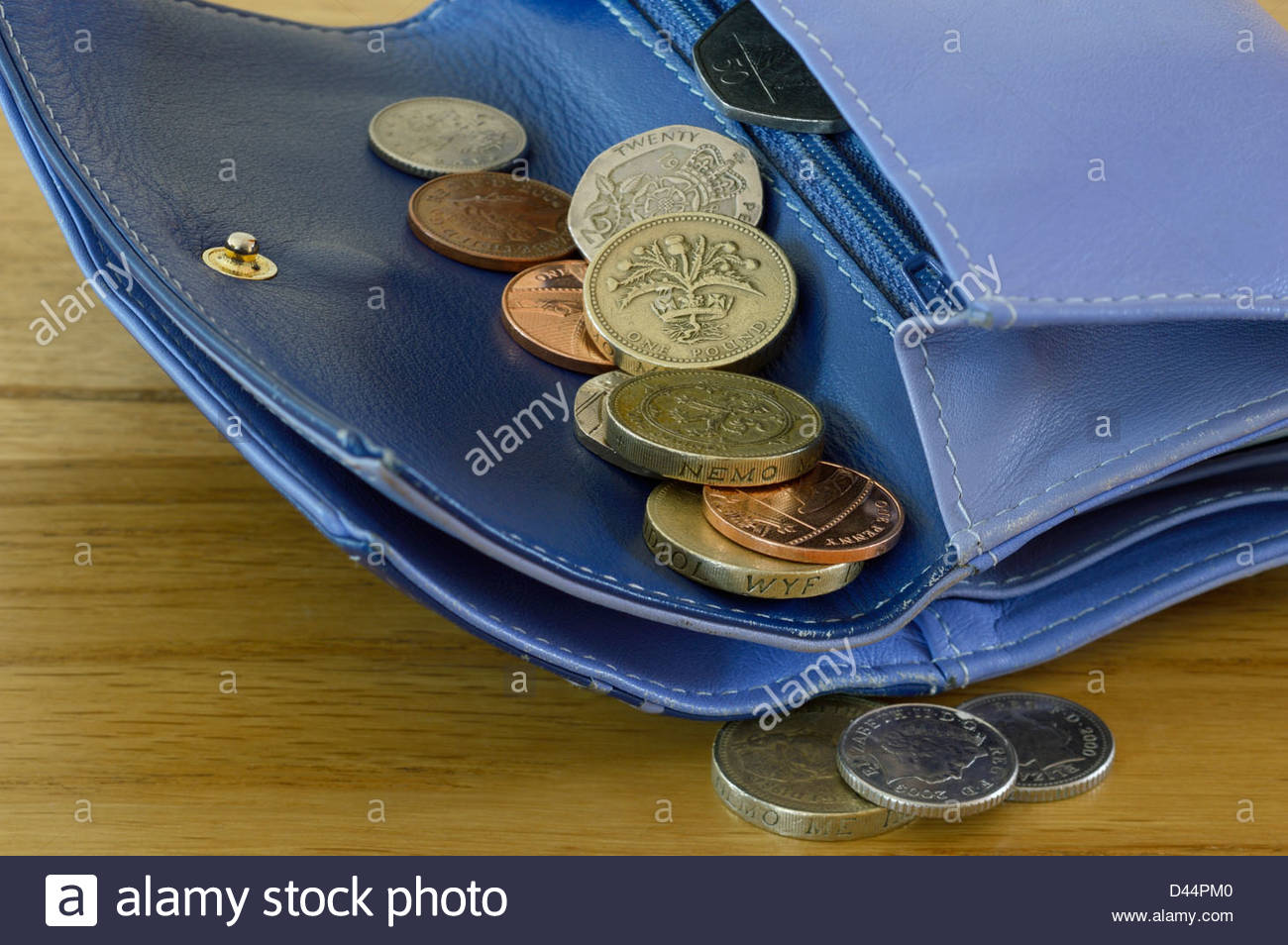 Money Falling Out Of Purse Stock Photos & Money Falling Out Of Purse
