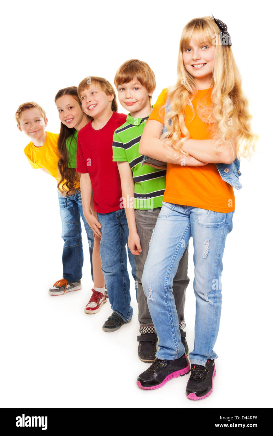 Friends standing in a line - eight years old boys and girls Stock Photo