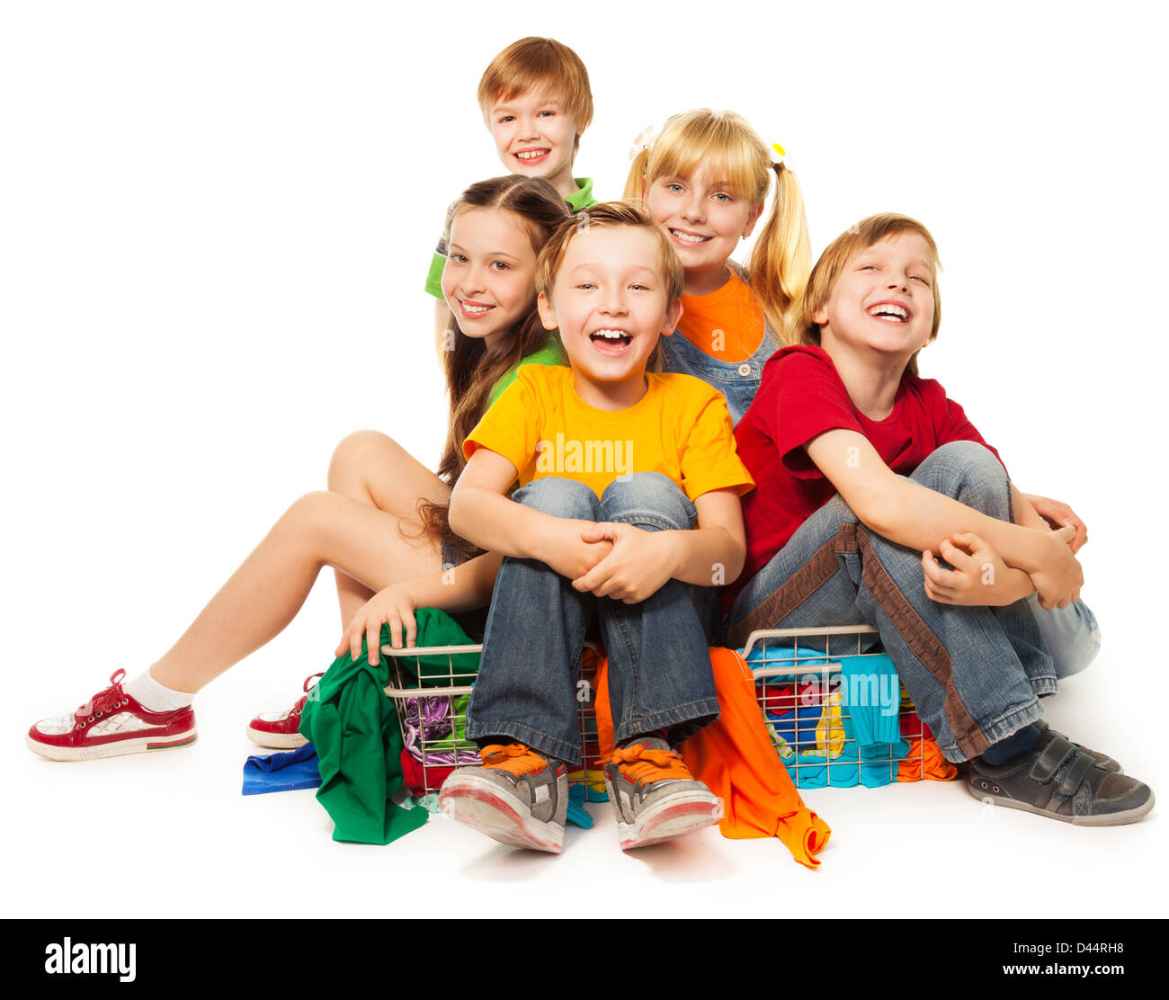 Bunch of kids having fun in clothing store Stock Photo