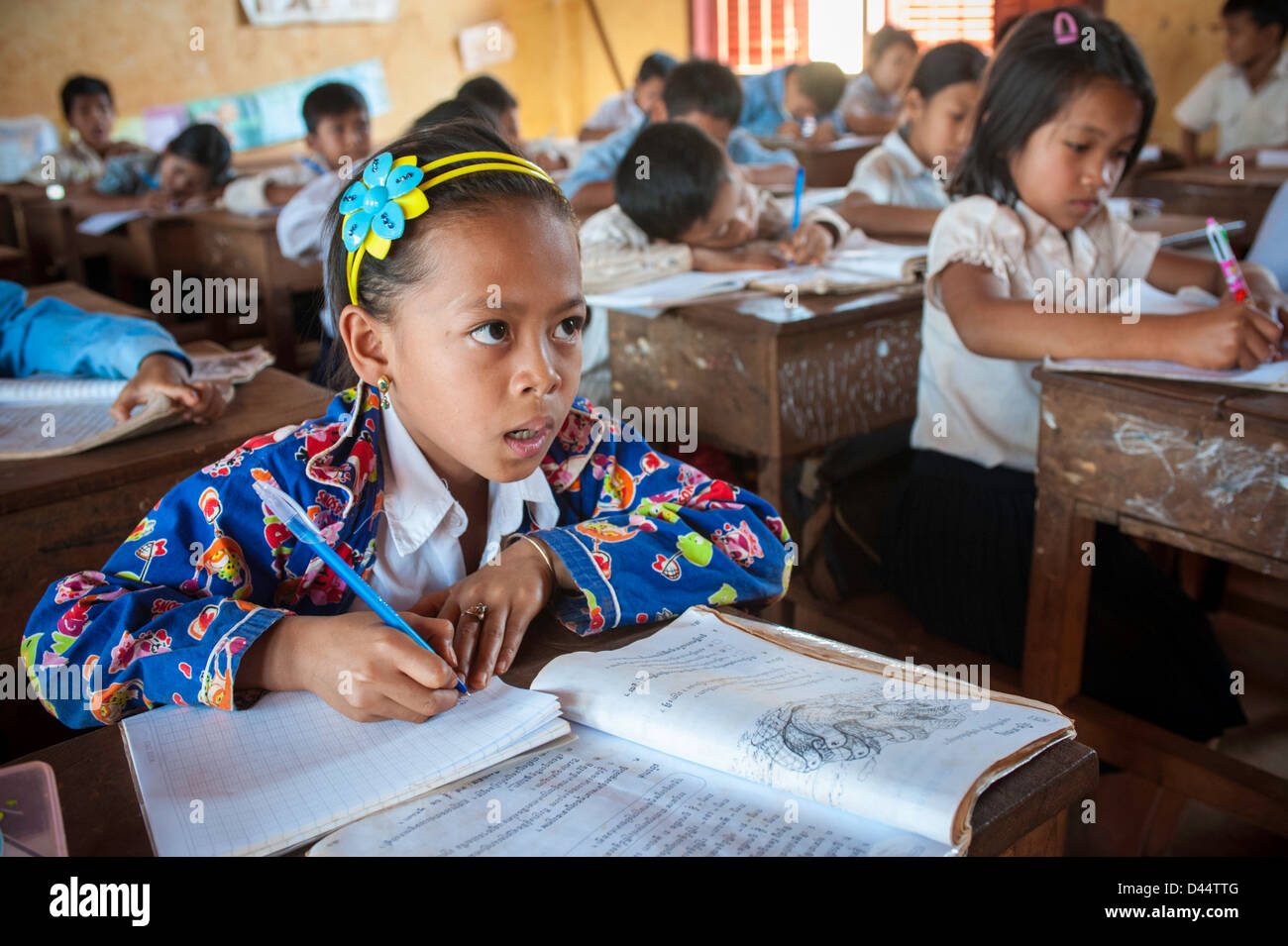 Young girl in school paying attention to the teacher in a Cambodia Cambodia school Stock Photo