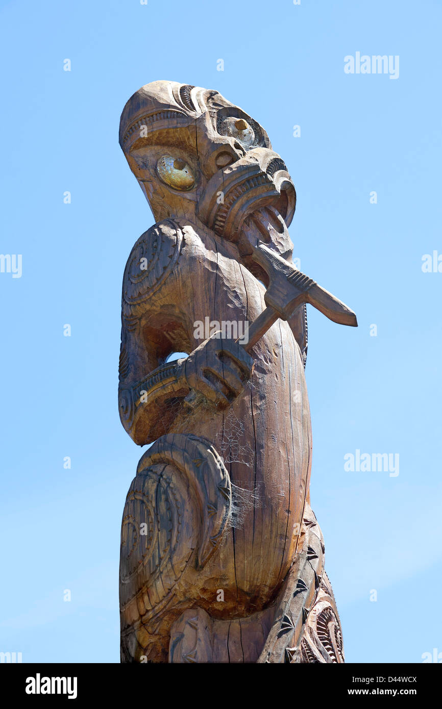 Wooden Maori statue at Karaka point historic reserve Stock Photo