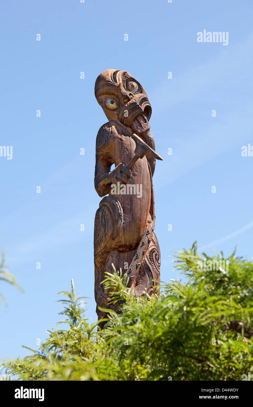 Wooden Maori statue at Karaka point in Waikara historic site Stock Photo