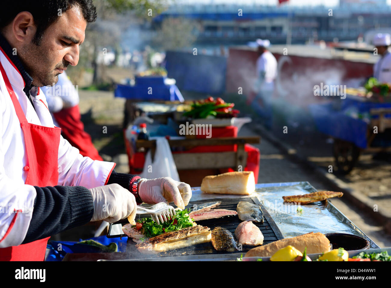 Preparing a Mackerel fish sandwich near the Galata bridge in Istanbul