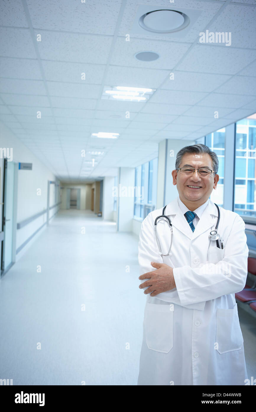 Smiling doctor crossed arms hi-res stock photography and images - Alamy
