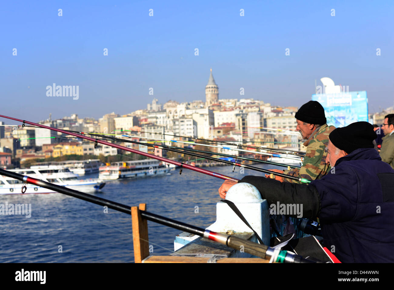 Fishermen on top of the Galata bridge in Istanbul. Stock Photo