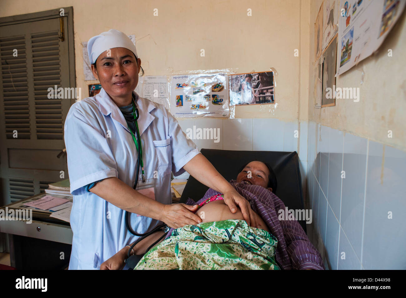 Nurse testing pregnant woman in Mondulkiri, Cambodia in a small rural village health clinic Stock Photo