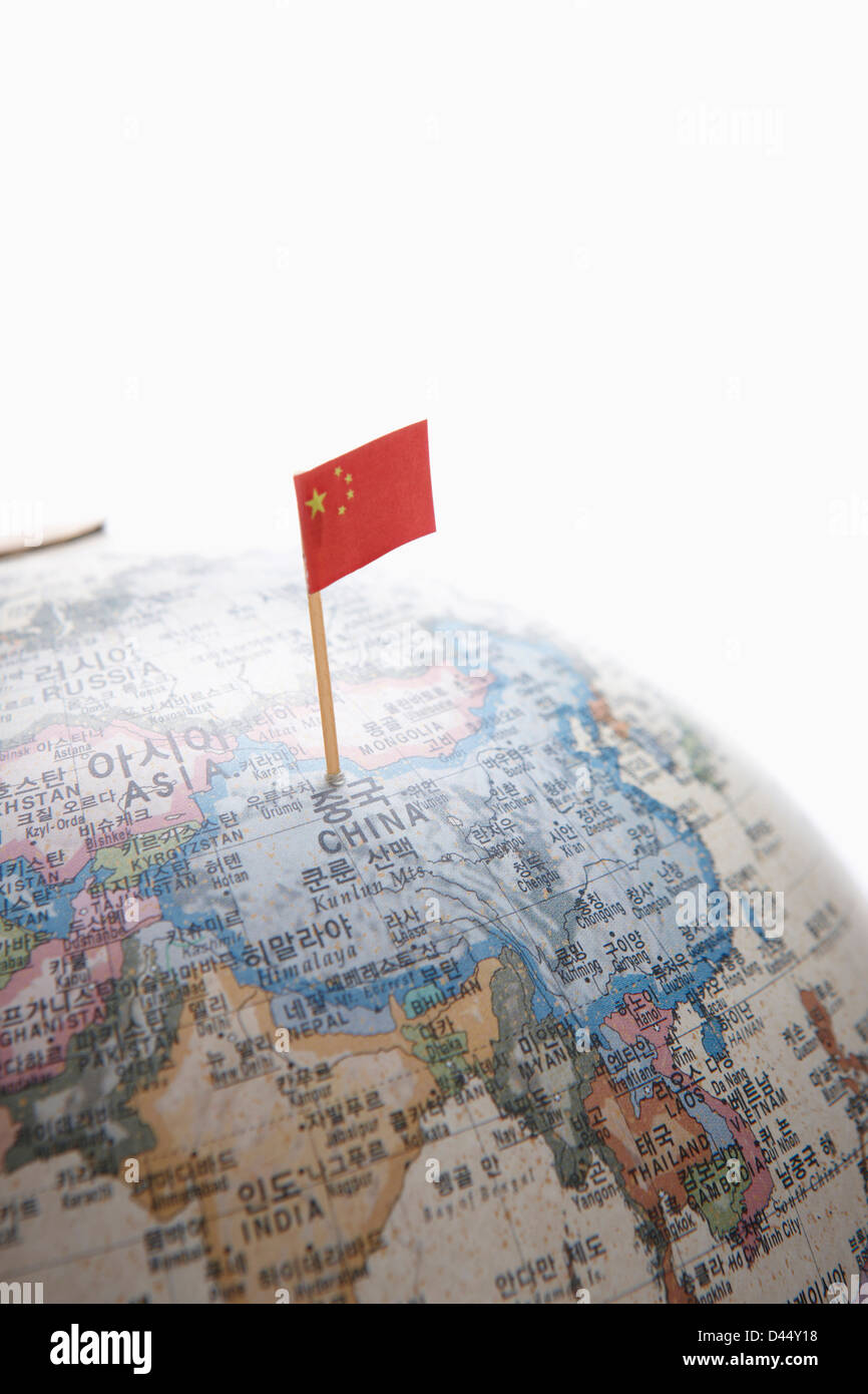 a Chinese flag on China part of a globe Stock Photo