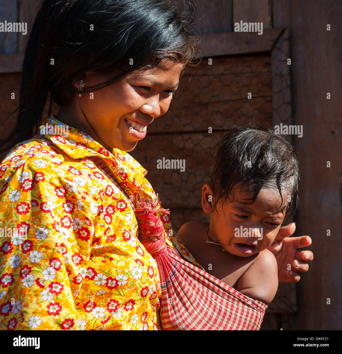 Cambodia mother with child in shawl Stock Photo
