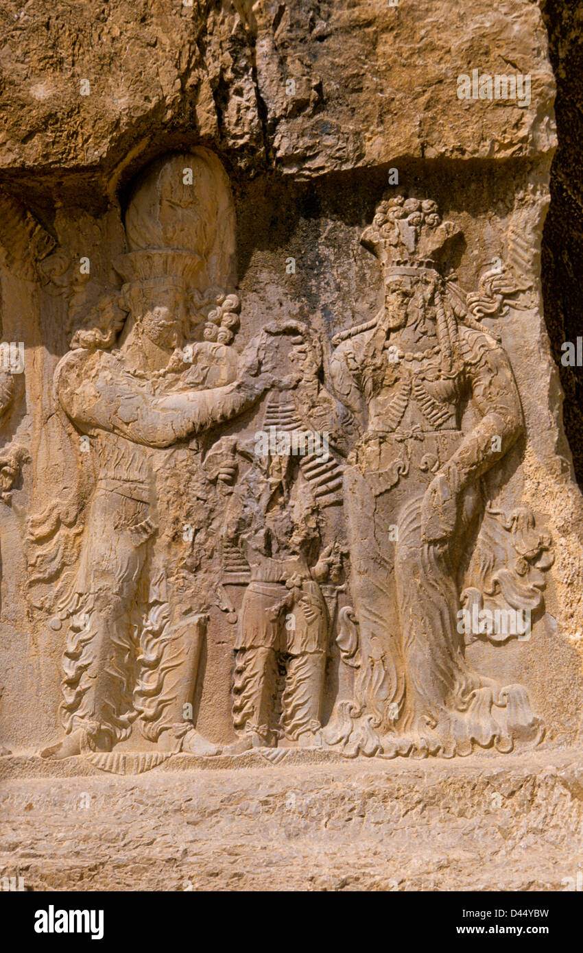 Relief in historic tomb of King Darius, Dareios II., Achaehenid burial site Naqsh-e Rostam, Rustam near Persepolis. Iran Stock Photo