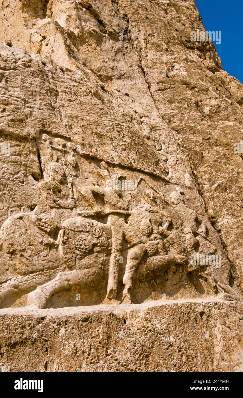 Relief in historic tomb of King Darius, Dareios II., Achaehenid burial site Naqsh-e Rostam, Rustam near Persepolis. Iran Stock Photo