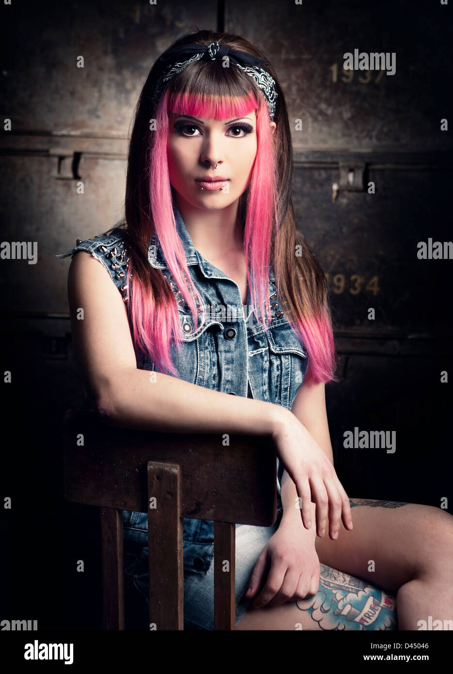 Portrait of a young punk girl with a nice hair cut in pink Stock Photo