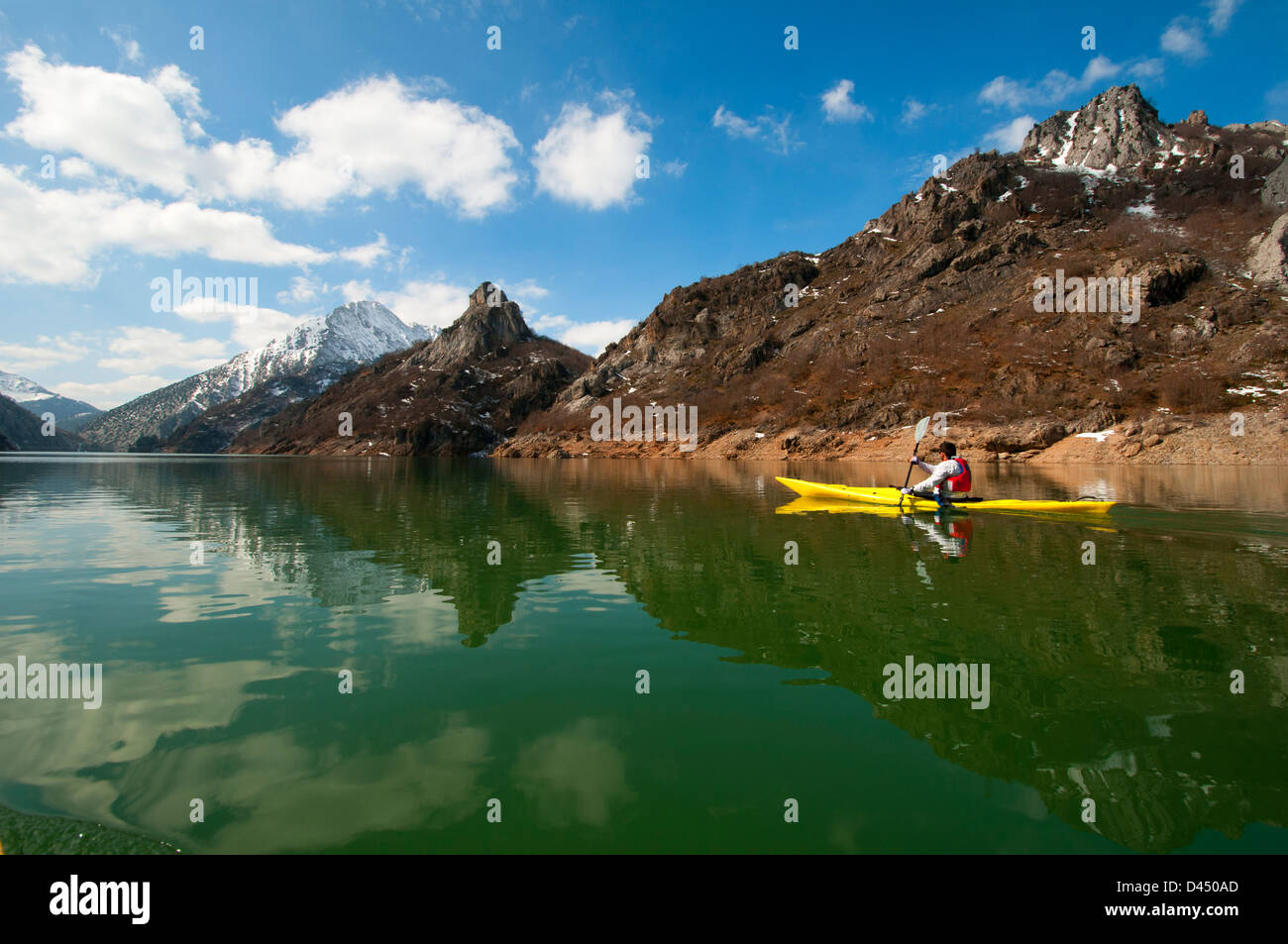 Winter canoe paddling on icy waters Stock Photo