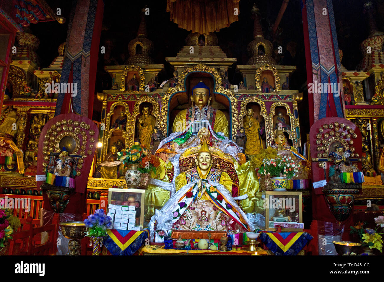 Golden chapel with statues of Dalai Lama and Buddha, Drepung monastery, Lhasa, Tibet Stock Photo