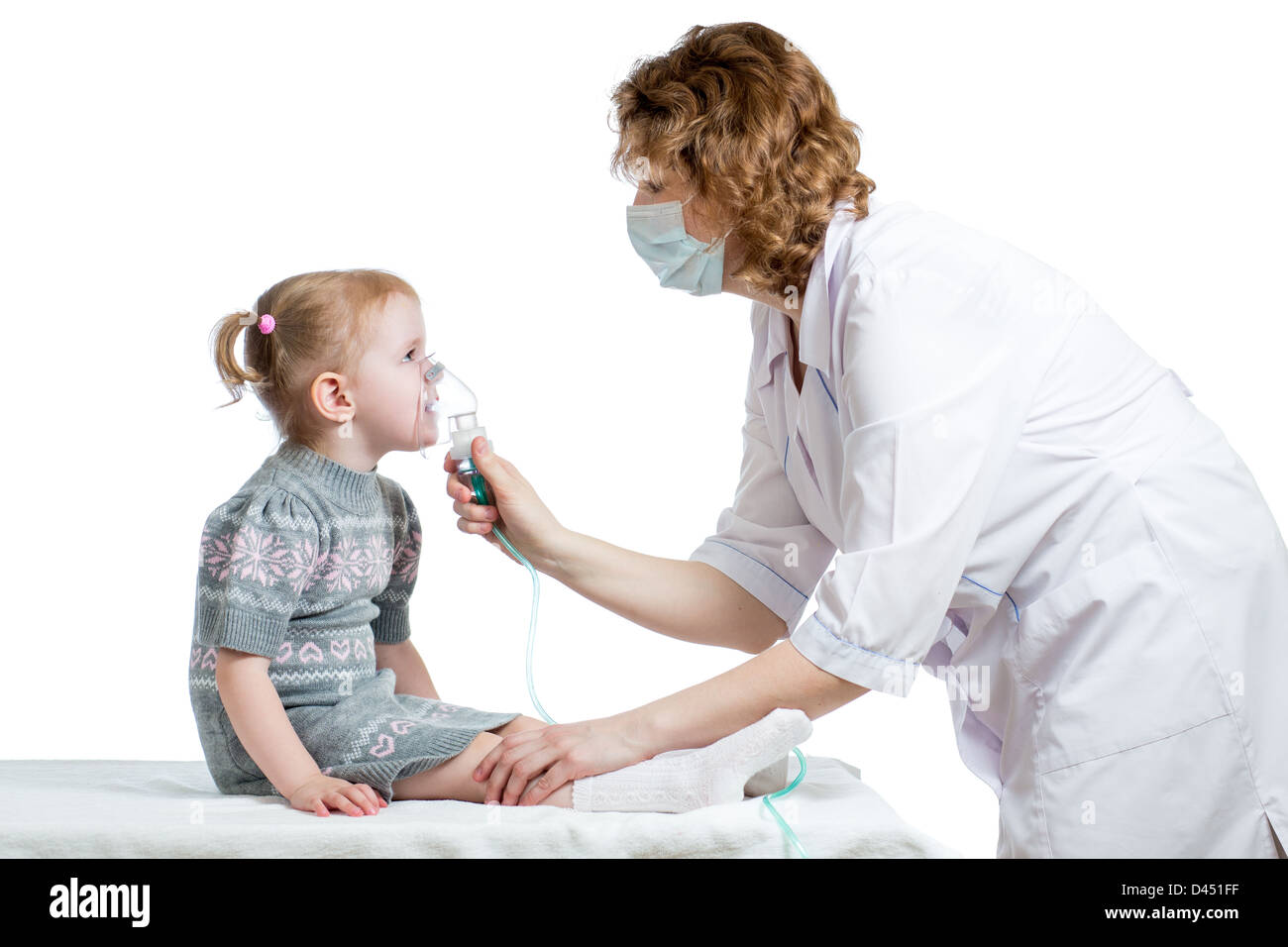 Doctor holding inhaler mask for kid breathing, hospital Stock Photo
