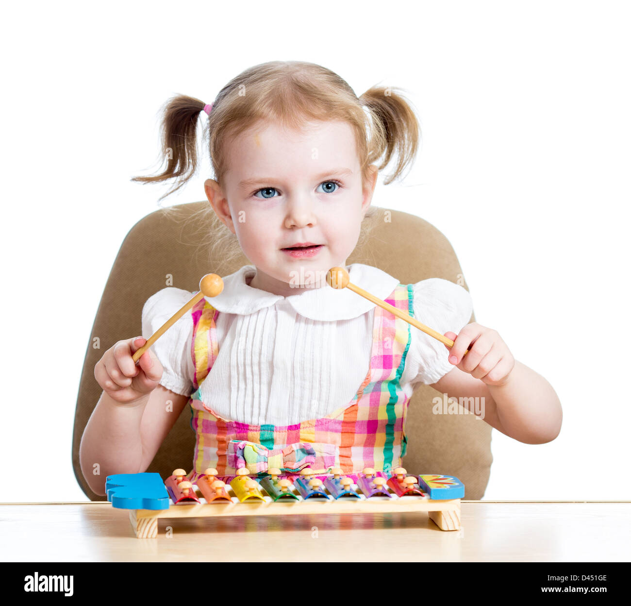 adorable child girl playing with musical toy Stock Photo Alamy
