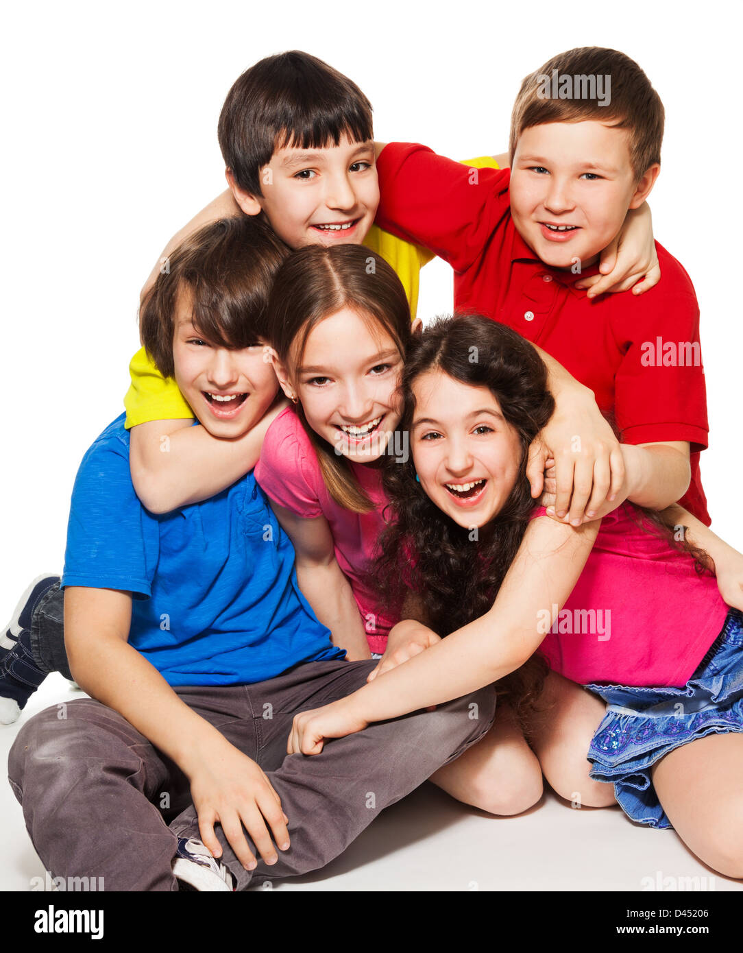 Group of happy kids sitting together and having fun Stock Photo