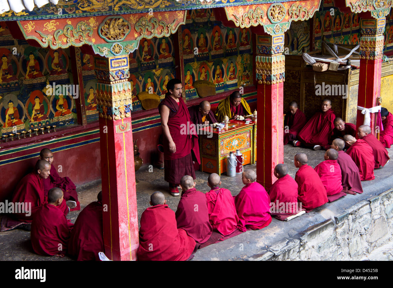 Young Buddhist monks in class with teacher Lamas, Tahsilhunpo monastery, Shigatse, Tibet Stock Photo