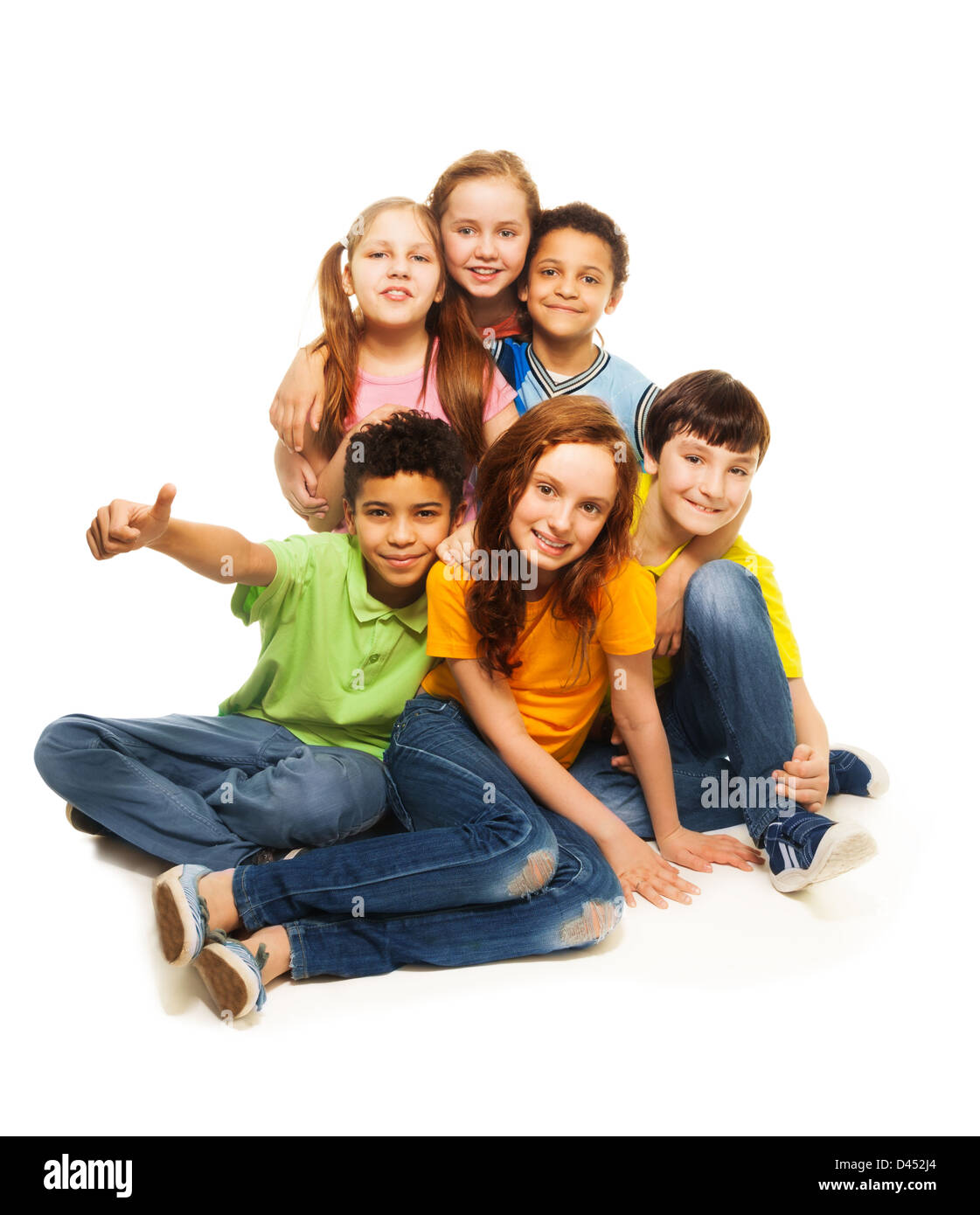 Positive happy group of kids sitting together, isolated on white Stock Photo