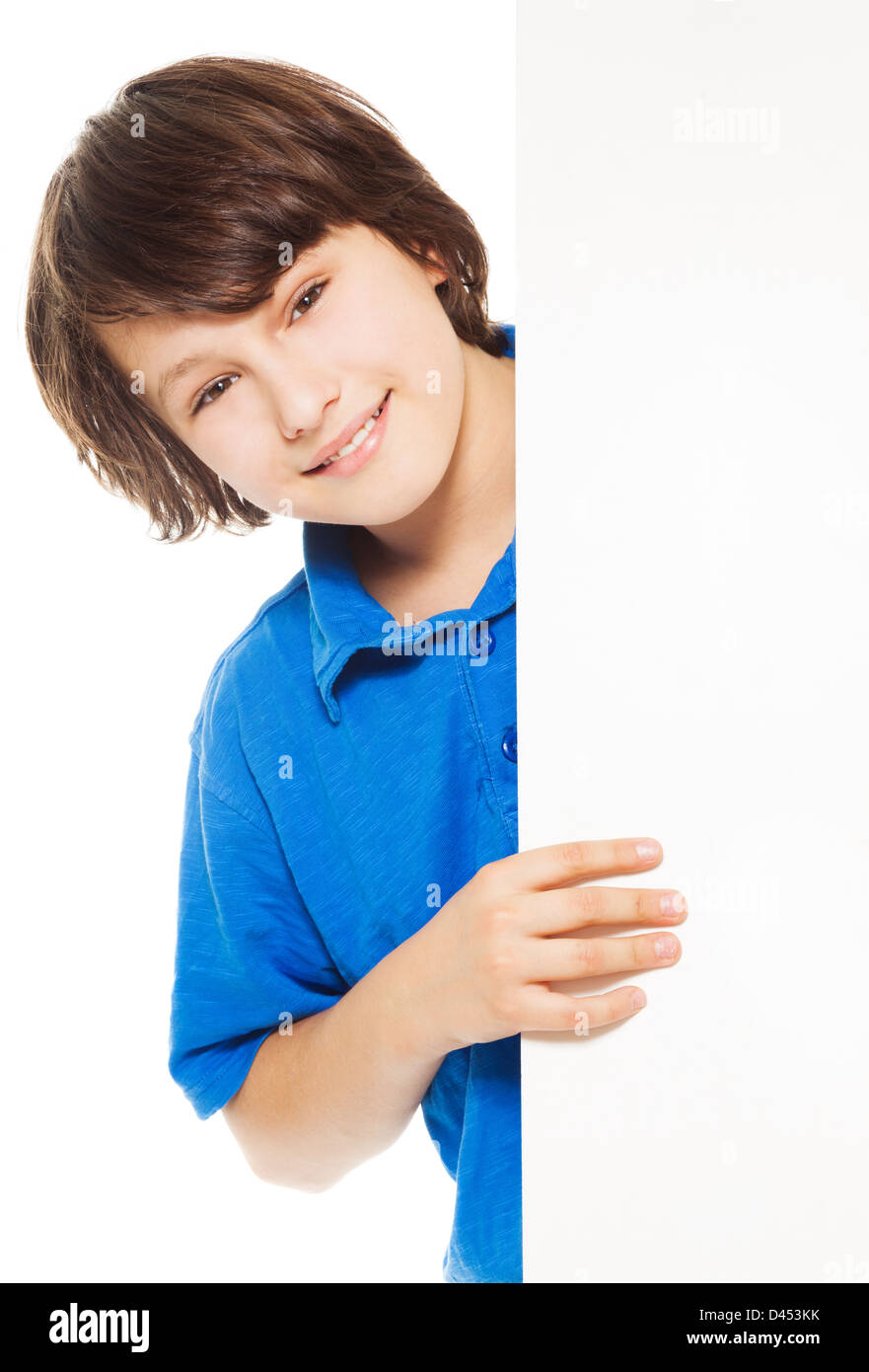 Handsome 11 years old Caucasian boy, standing and smiling looking from  behind white placard, isolated on white Stock Photo - Alamy