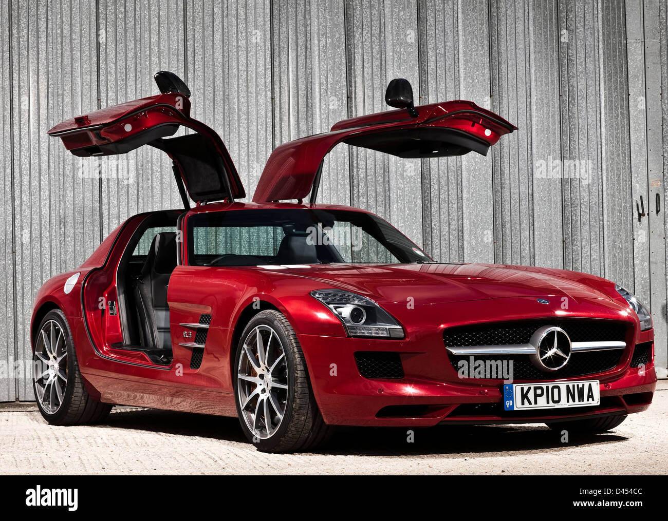 Red Mercedes Benz SLS AMG luxury car with wing doors, Winchester, UK, 03 09 2010 Stock Photo