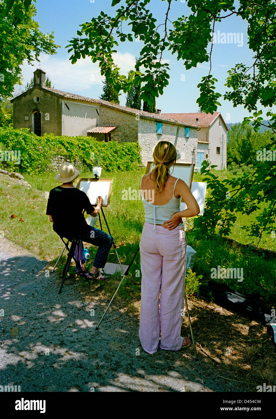 Two artists working on their paintings in Provence, France Stock Photo