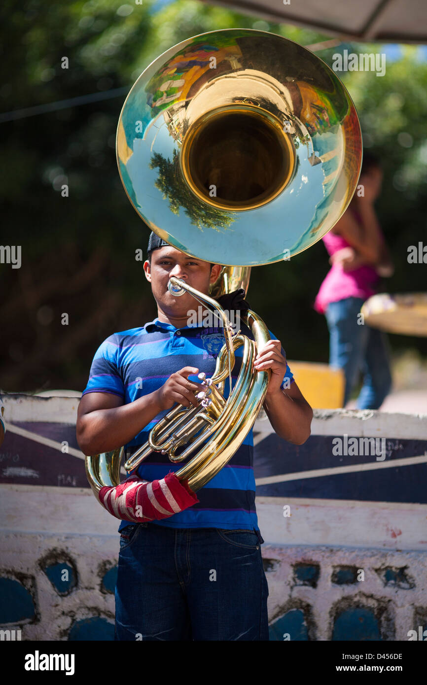 A musician plays music in the plaza during the fiesta de San Sebastian